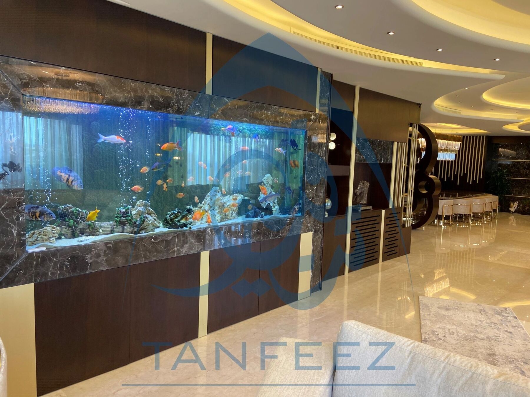 Living area with a built-in aquarium wall